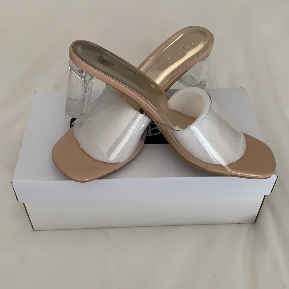Brand new clear heels and clear strap.